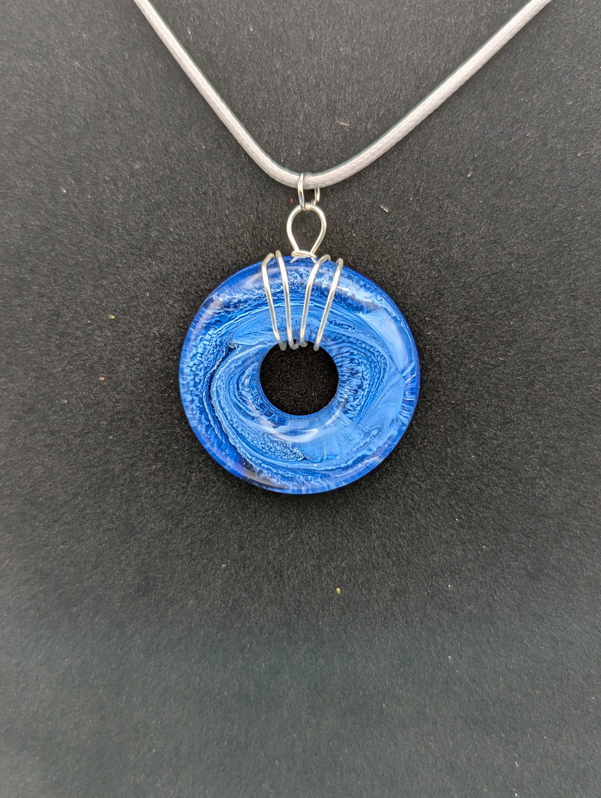 Wire Wrapped Donut Resin Pendant Necklace - Petri Effect with shades of blue swirls. Resin Necklace on a waxed cotton cord.