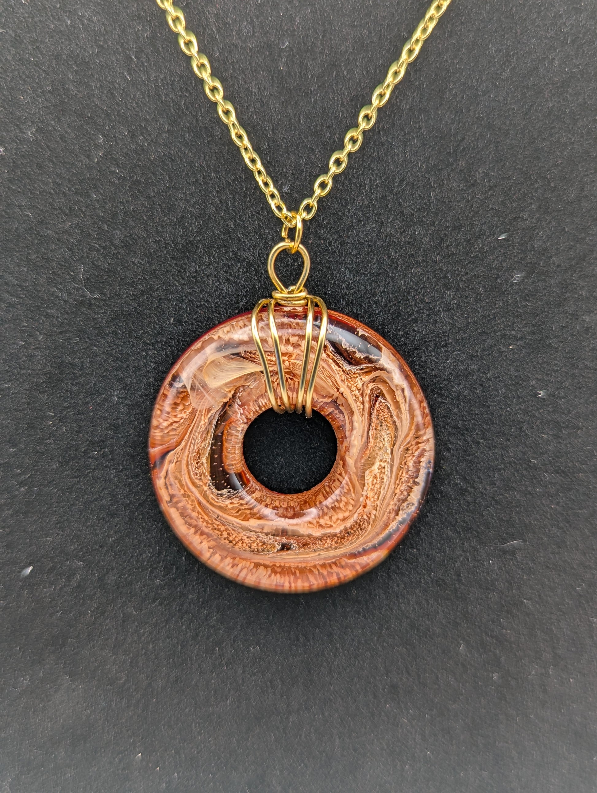 Wire Wrapped Donut Resin Pendant Necklace - Petri Effect with shades of orange & red swirls. Resin Necklace on a gold plated chain.