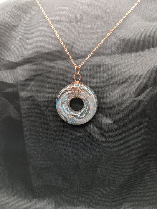 Wire Wrapped Donut Resin Pendant Necklace - Petri Effect with shades of blue & metallic bronze swirls. Resin Necklace on a rose gold colored stainless steel metal chain