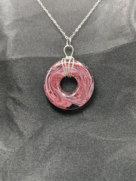 Wire Wrapped Donut Resin Pendant Necklace - Petri Effect with shades of red, pink, & black swirls. Resin Necklace on a stainless steel chain.
