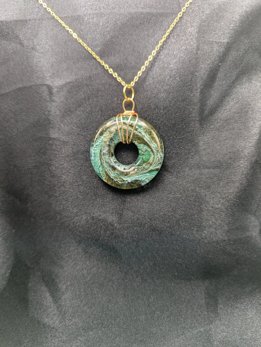 Wire Wrapped Donut Resin Pendant Necklace - Petri Effect with shades of green & brass swirls. Resin Necklace on a gold plated metal chain.