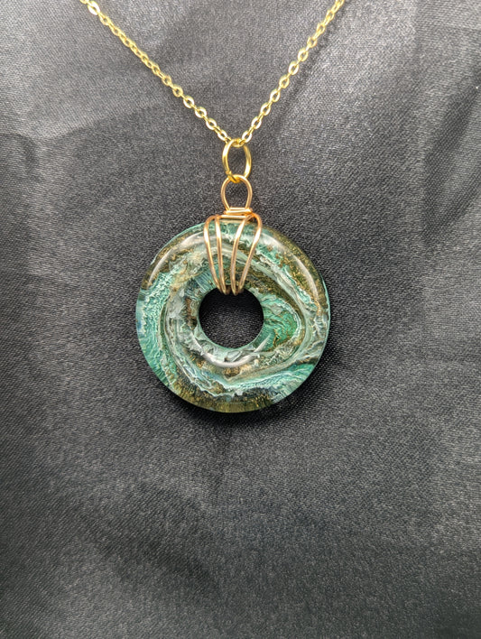 Wire Wrapped Donut Resin Pendant Necklace - Petri Effect with shades of green & brass swirls. Resin Necklace on a gold plated metal chain.