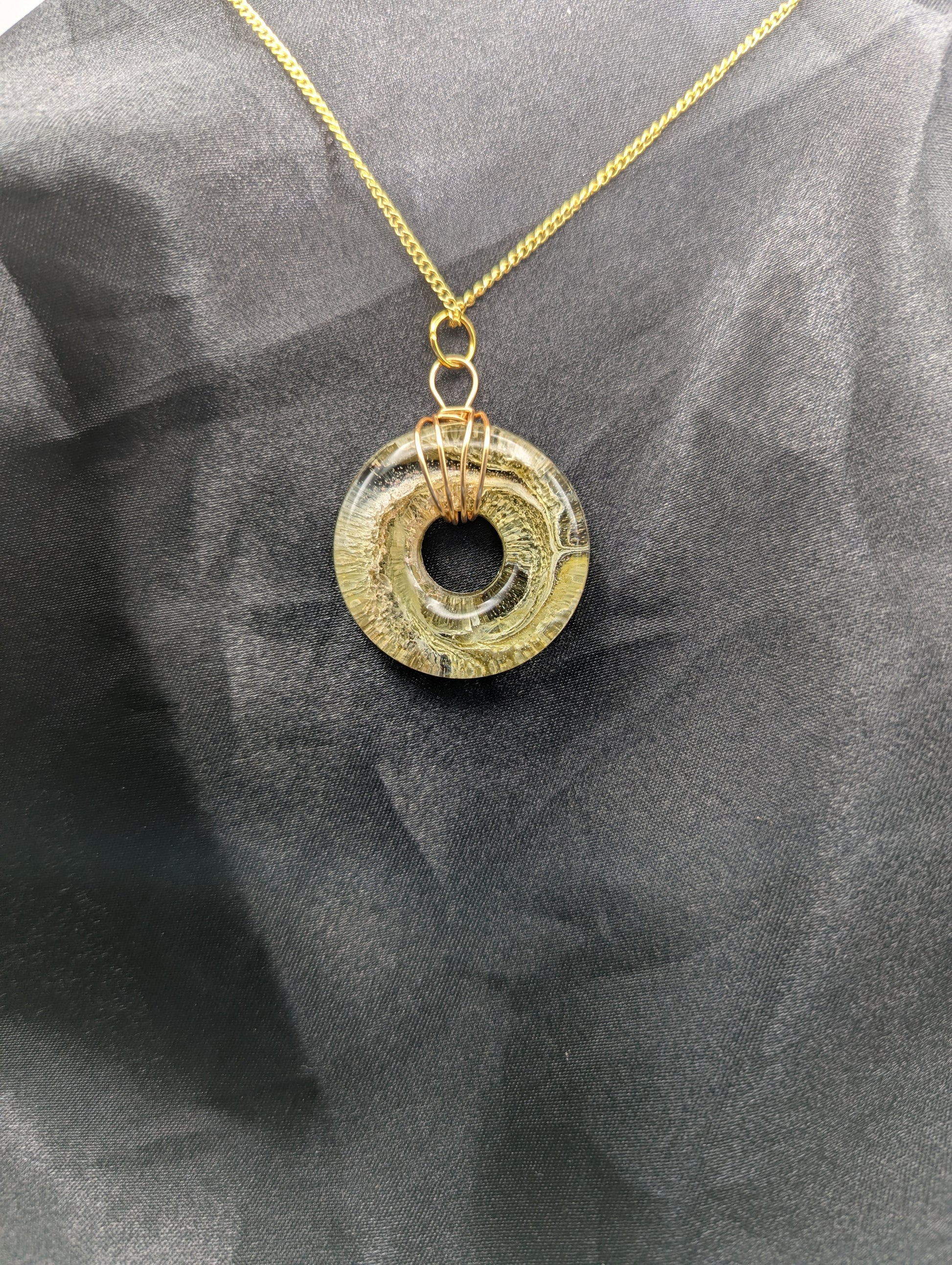 Wire Wrapped Donut Resin Pendant Necklace - Petri Effect with shades of light yellow & light green swirls. Resin Necklace on a gold plated metal chain.