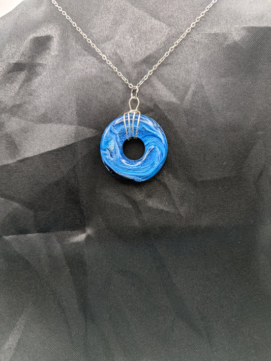 Wire Wrapped Donut Resin Pendant Necklace - Petri Effect with shades of blue swirls. Resin Necklace on a stainless steel chain