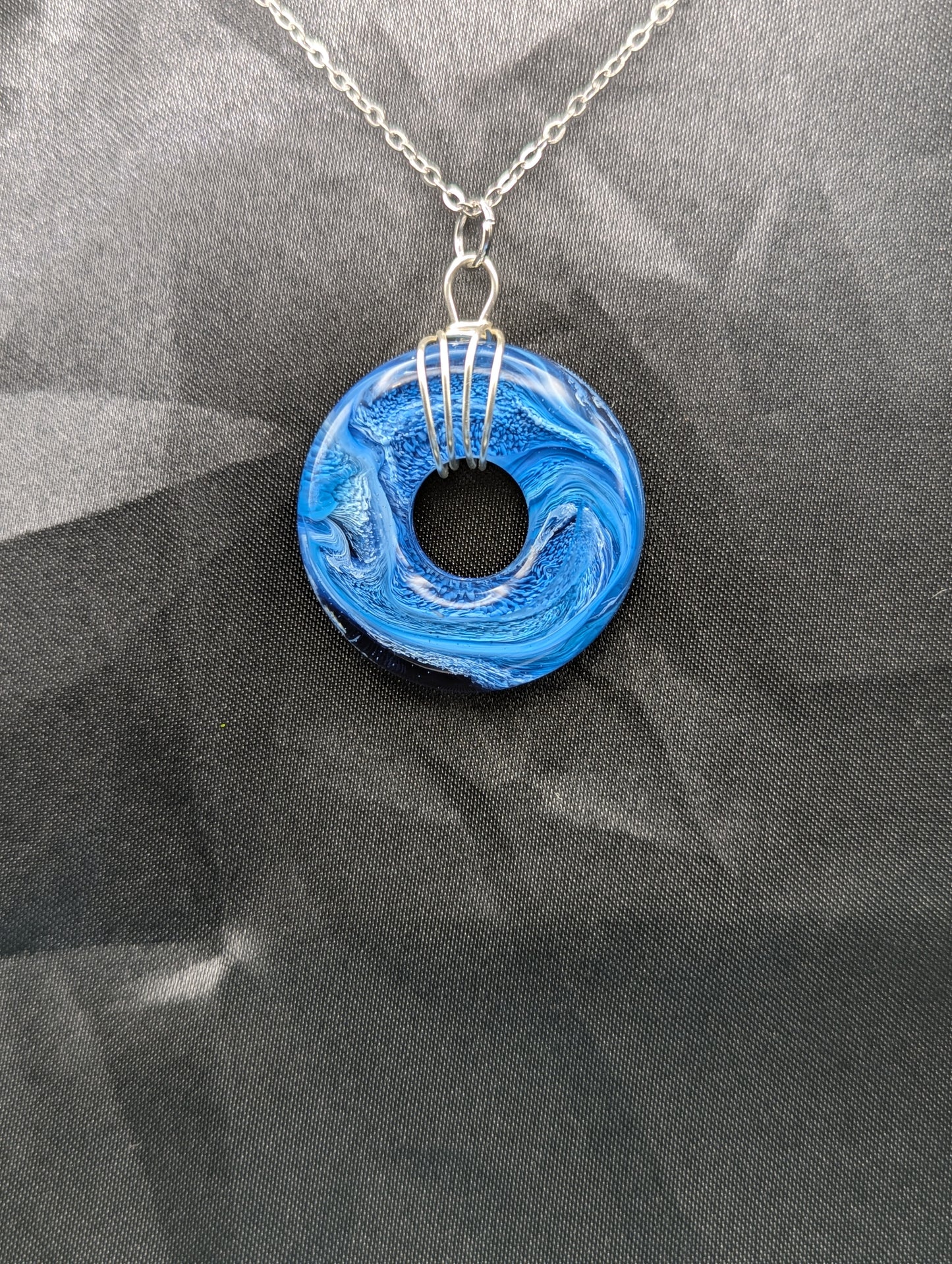 Wire Wrapped Donut Resin Pendant Necklace - Petri Effect with shades of blue swirls. Resin Necklace on a stainless steel chain