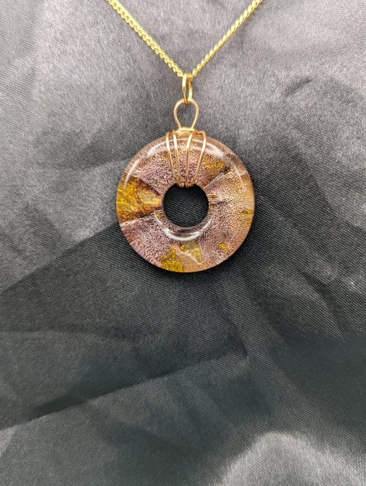 Wire Wrapped Donut Resin Pendant Necklace - Petri Effect with shades of red & gold swirls. Resin Necklace on a gold plated metal chain.