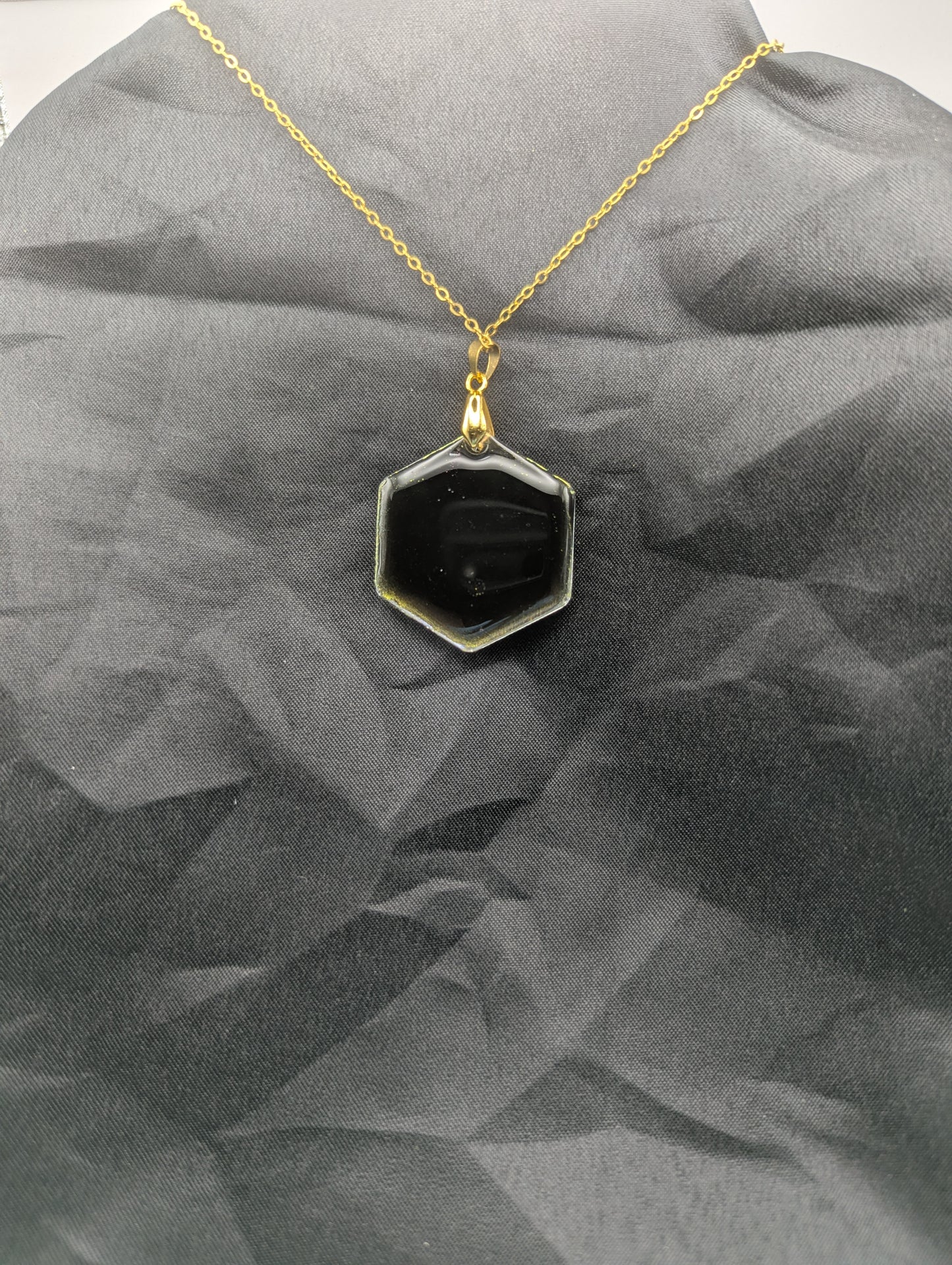 Back view of Color Shifting Hexagon Resin Pendant Necklace on a gold plated metal chain.