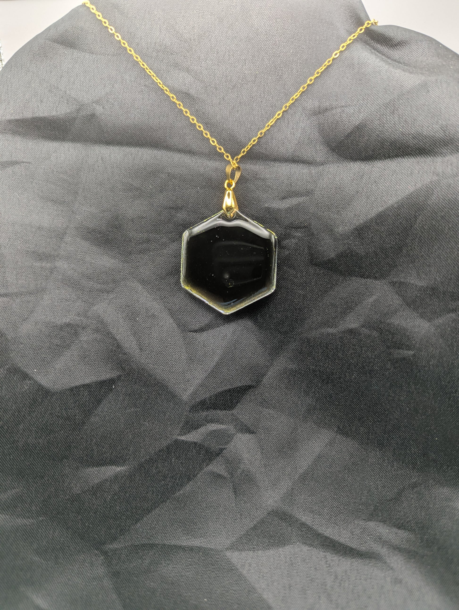 Back view of Color Shifting Hexagon Resin Pendant Necklace on a gold plated metal chain.