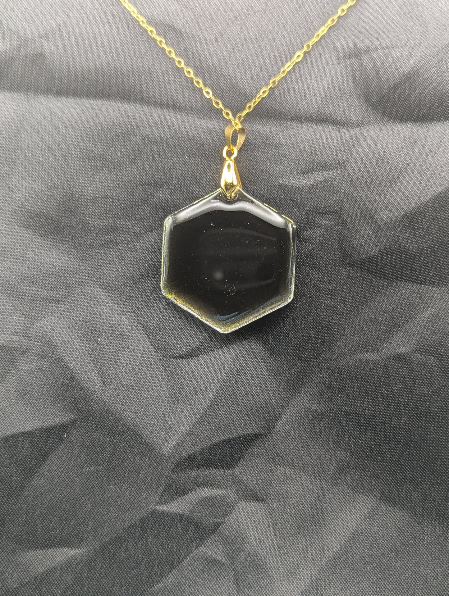 Back view of Color Shifting Hexagon Resin Pendant Necklace on a gold plated metal chain.