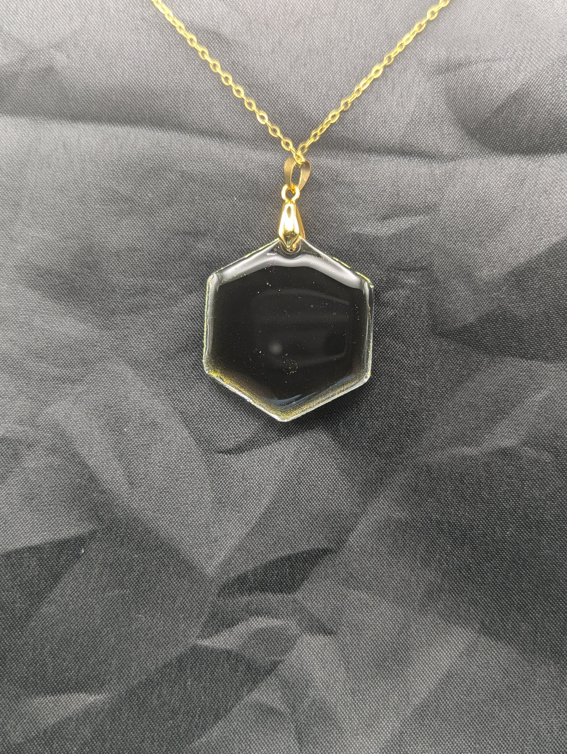Back view of Color Shifting Hexagon Resin Pendant Necklace on a gold plated metal chain.