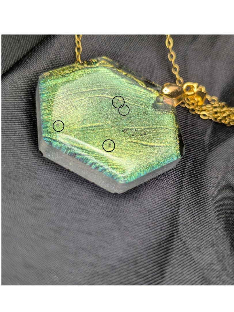 Color Shift Hexagon Resin pendant necklace on a gold plated metal chain