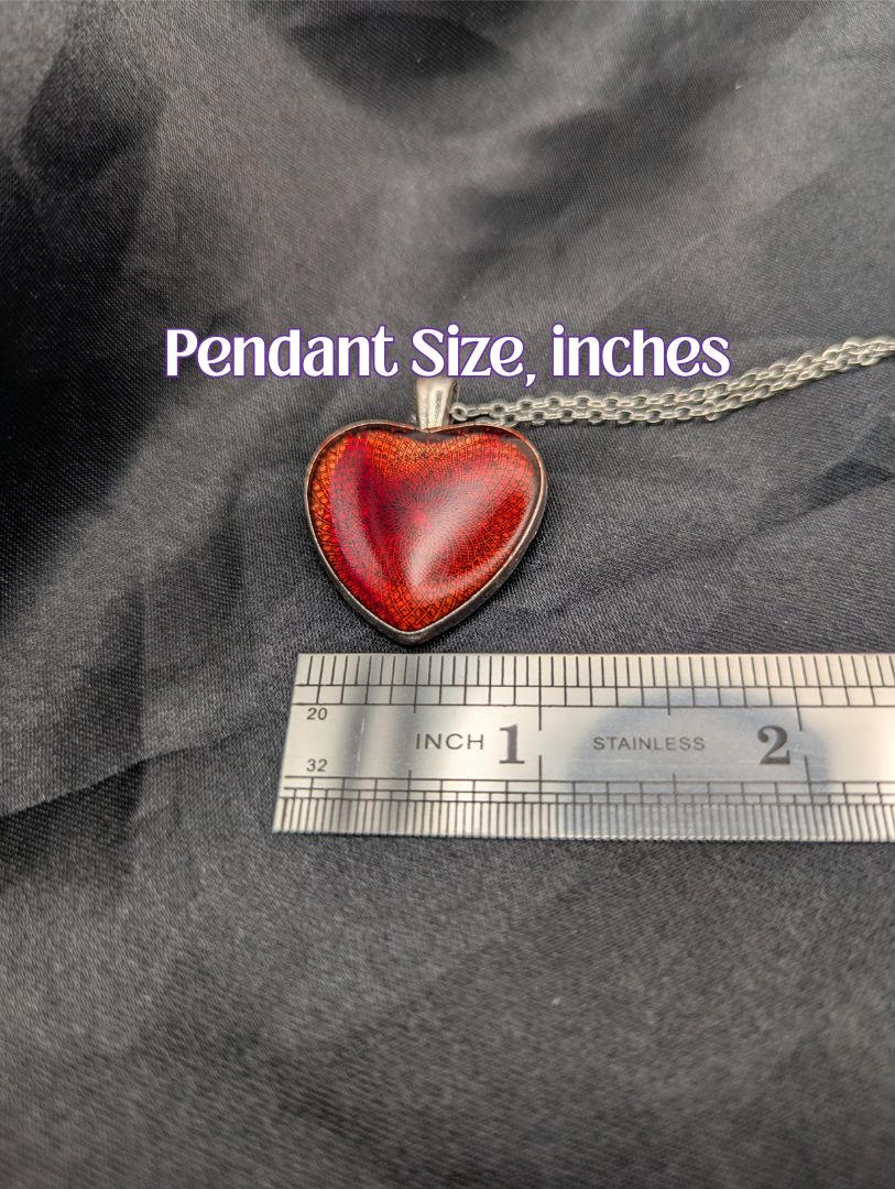 Size example pic of pendant size in inches, showing pendant is about 1 inch wide