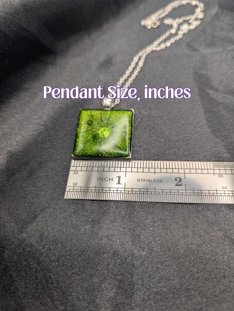 Size example pic of pendant size in inches, showing pendant is about 1 inch wide
