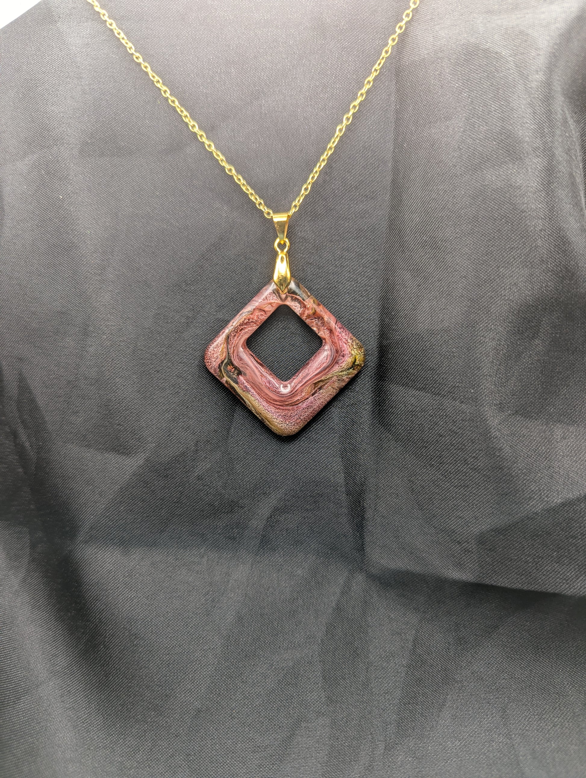 Pink & brown swirl square pendant necklace on a gold plated metal chain