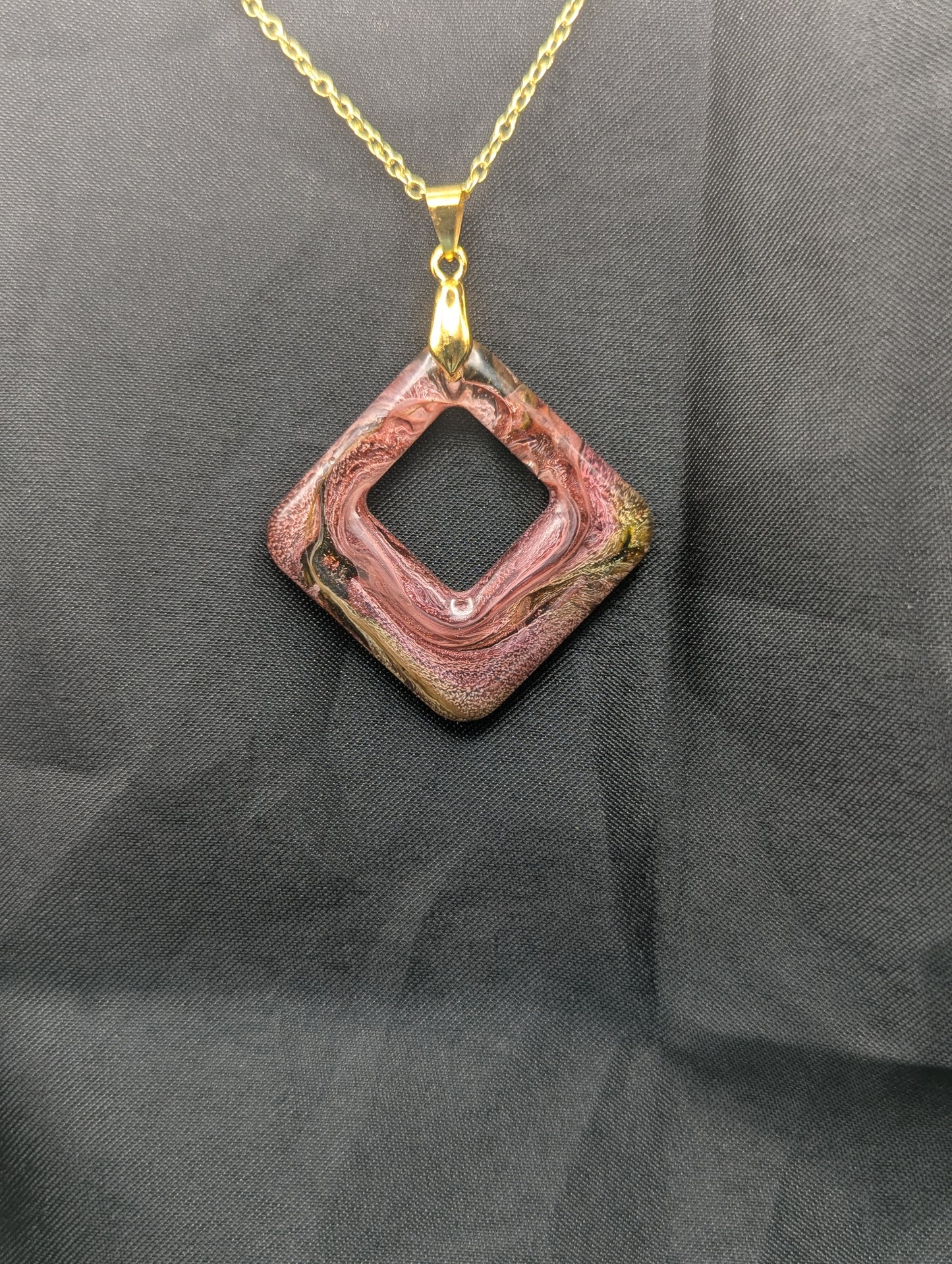 Pink & brown swirl square pendant necklace on a gold plated metal chain