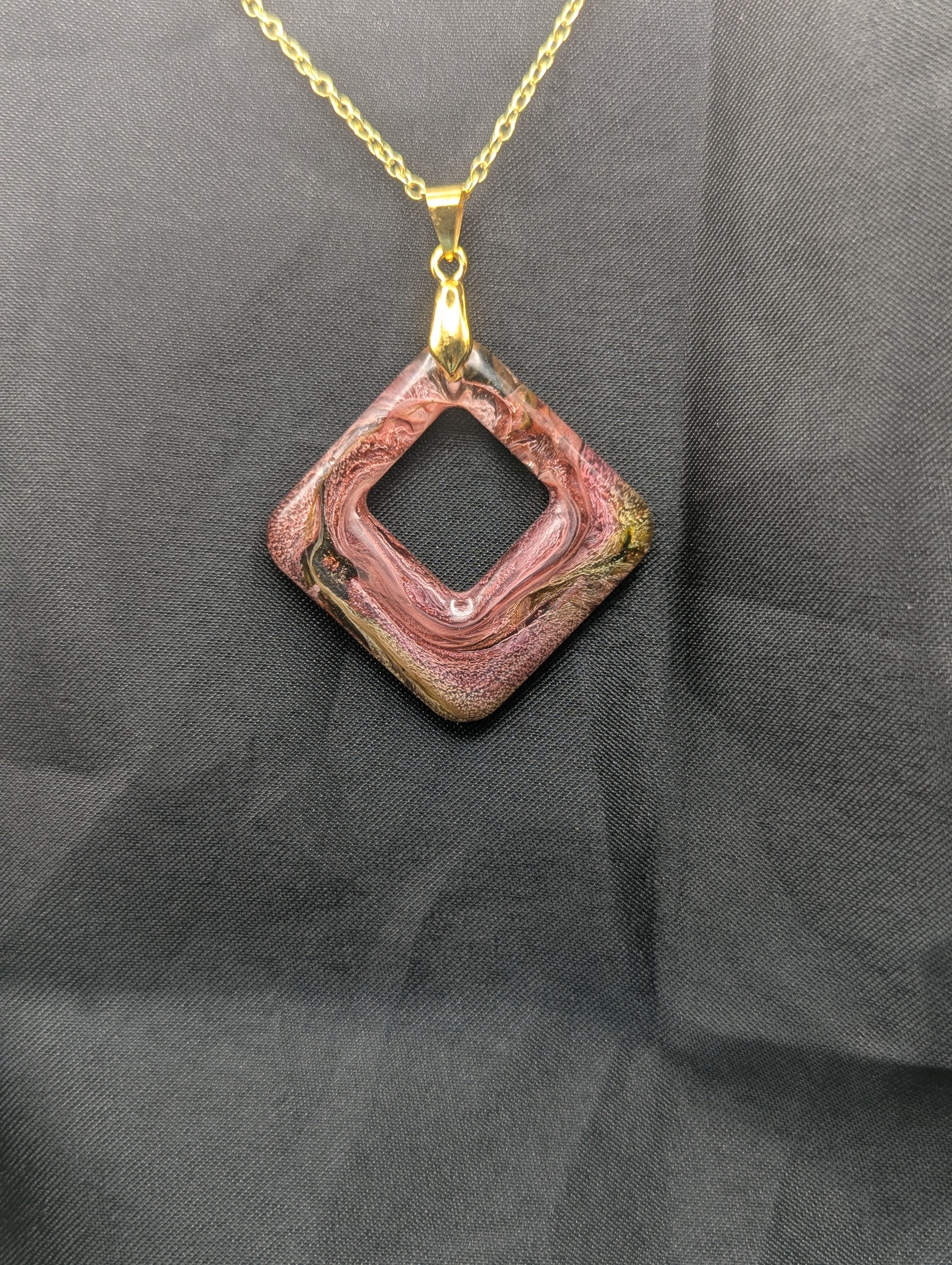 Pink & brown swirl square pendant necklace on a gold plated metal chain