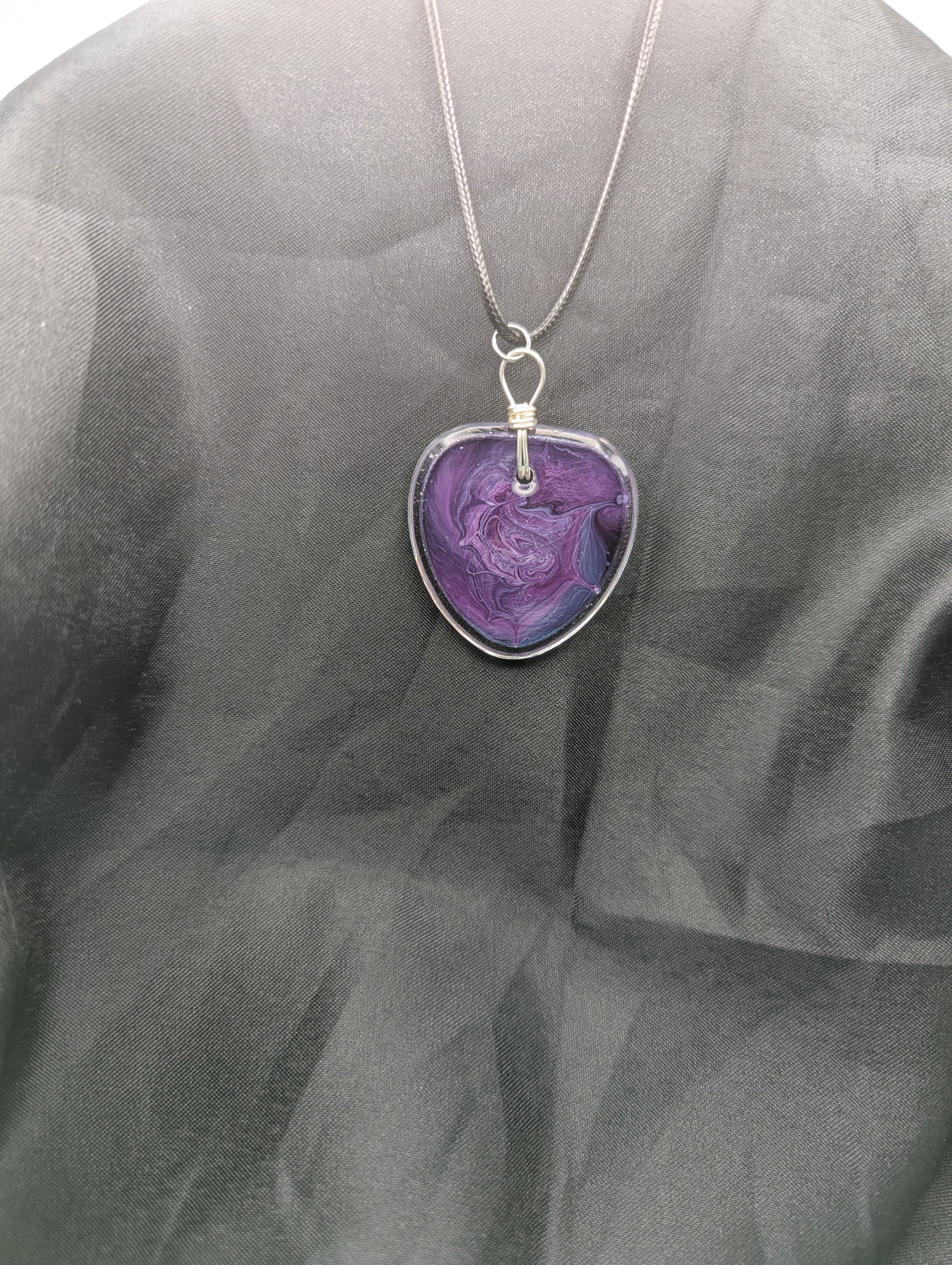 Back view of Wire Wrapped Arrow Resin Pendant Necklace - Petri Effect with shades of purple & blue swirls. Resin Necklace on a waxed cotton cord.
