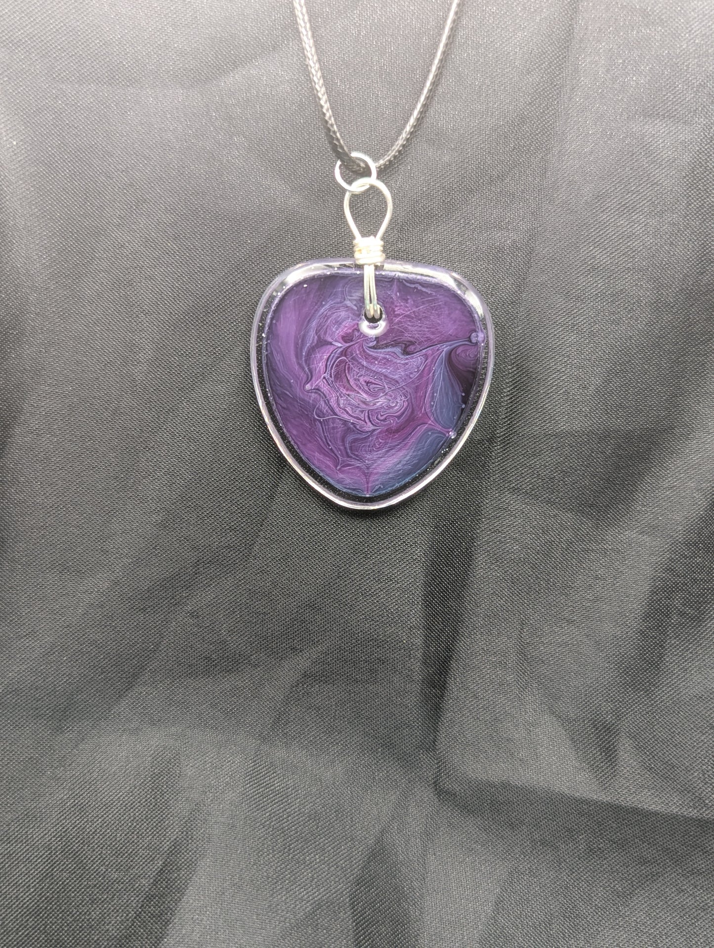 Back view of Wire Wrapped Arrow Resin Pendant Necklace - Petri Effect with shades of purple & blue swirls. Resin Necklace on a waxed cotton cord.