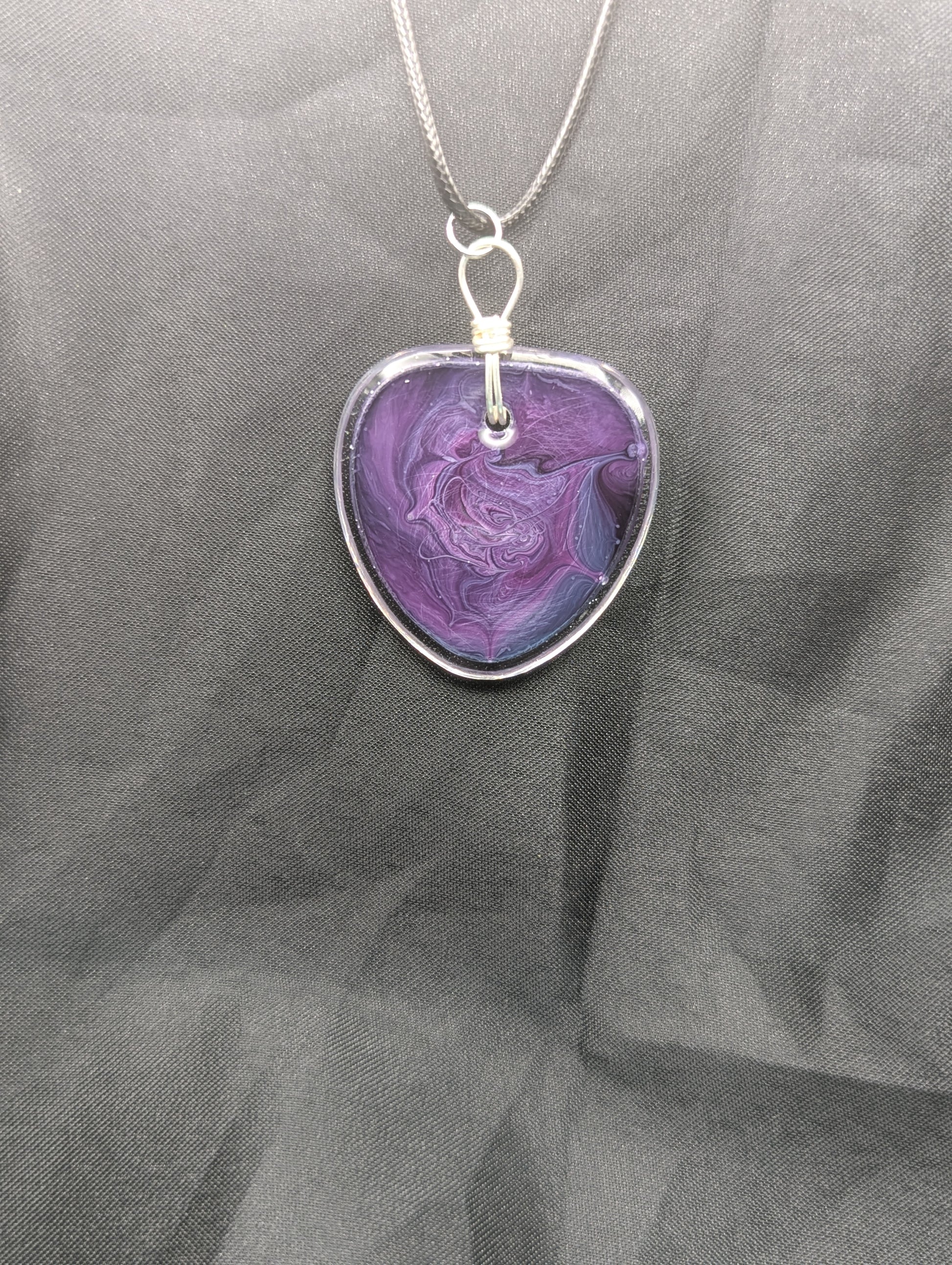 Back view of Wire Wrapped Arrow Resin Pendant Necklace - Petri Effect with shades of purple & blue swirls. Resin Necklace on a waxed cotton cord.
