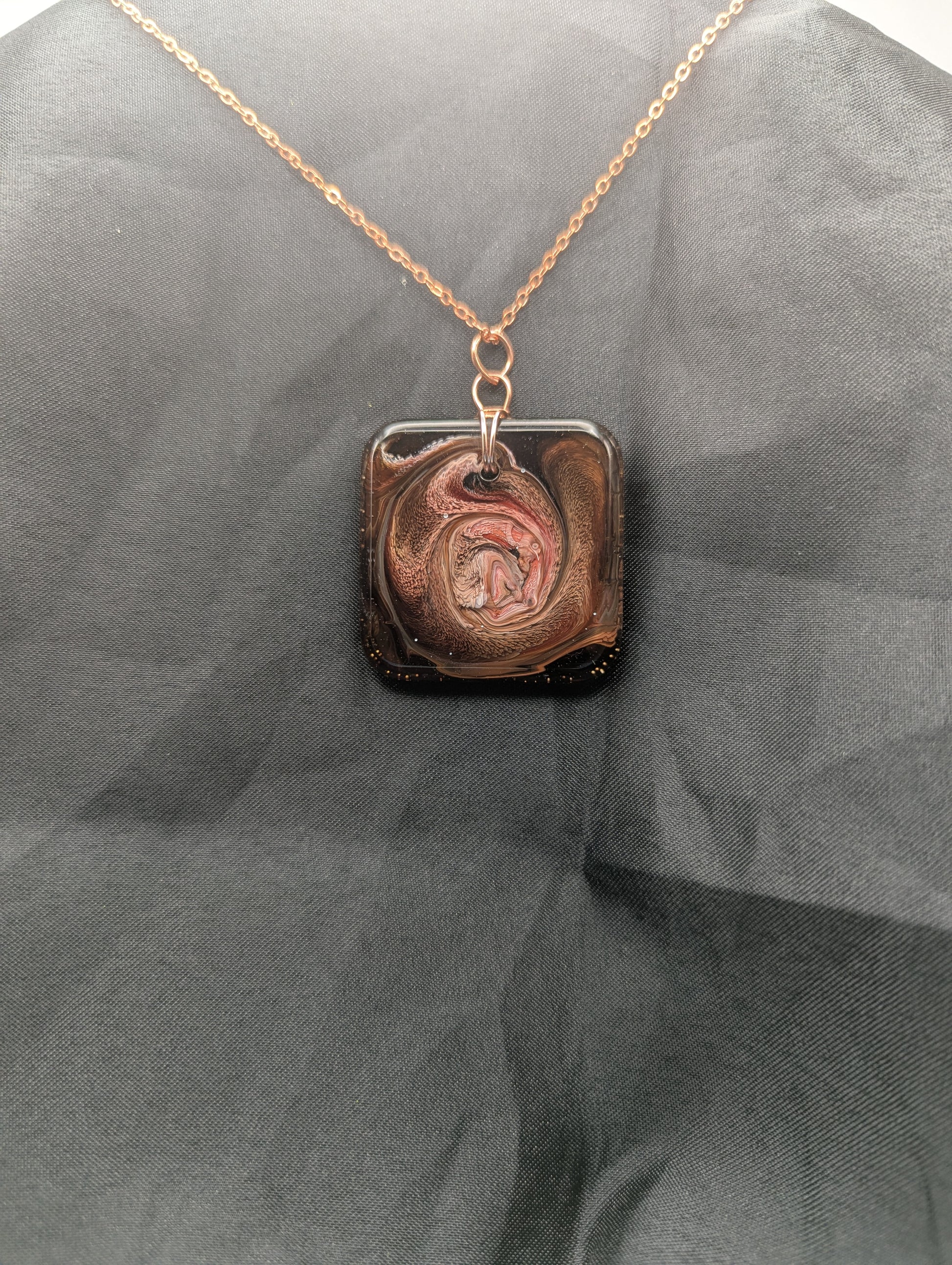 Red & Brown Swirl Square Pendant wrapped in a solid copper wire on a rose gold colored stainless steel plated metal chain. Resin Square Jewelry Pendant with Petri Effect.