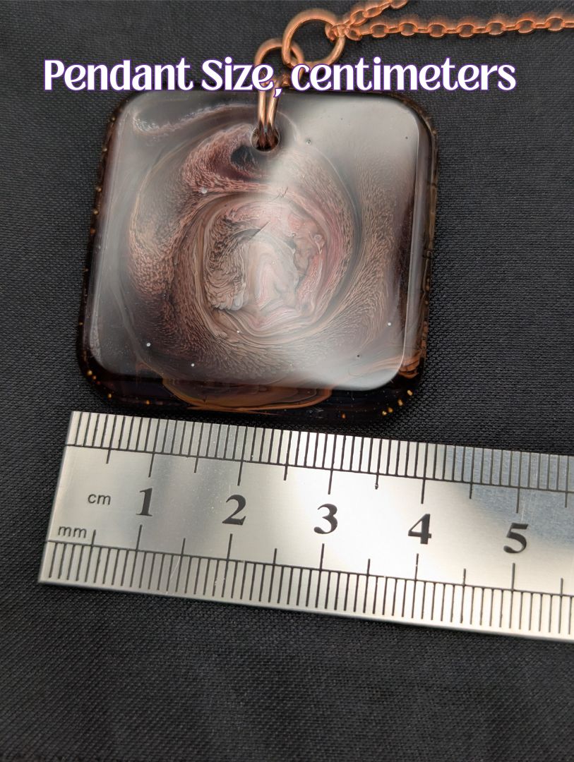 Size example pic of pendant size in centimeters, showing pendant is about 3.75 centimeters across.