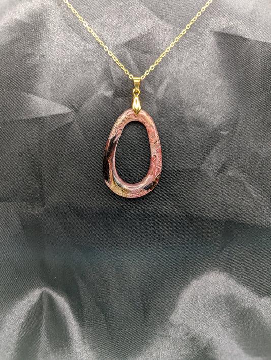Pink & Orange Zero Shaped Resin Pendant Necklace - Petri Effect with shades of pink, orange, & red swirls. Resin Necklace on a gold pinch bail & gold plated metal chain.