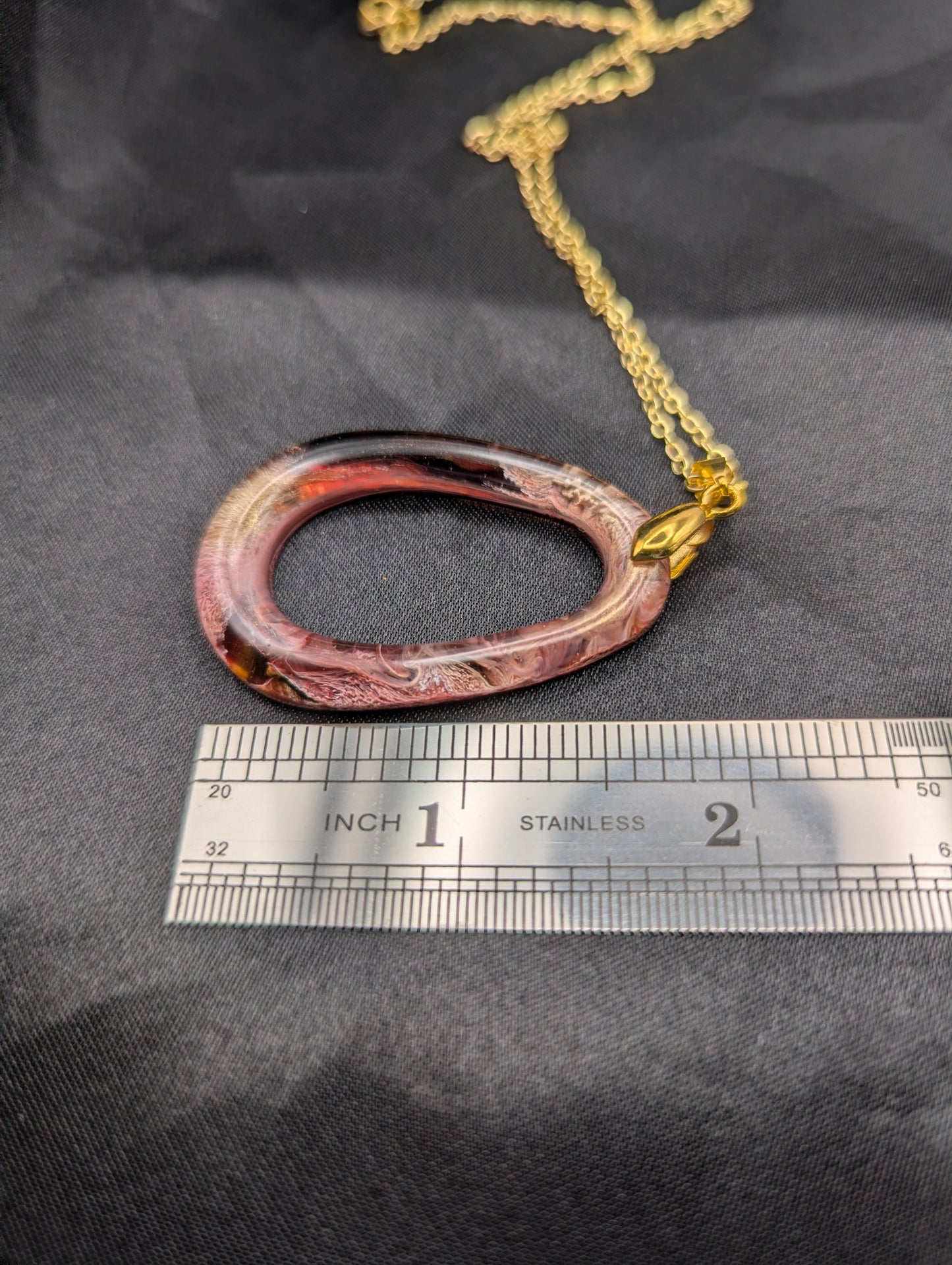 Size example pic of pendant size in inches, showing pendant is about 1.75 inches long.