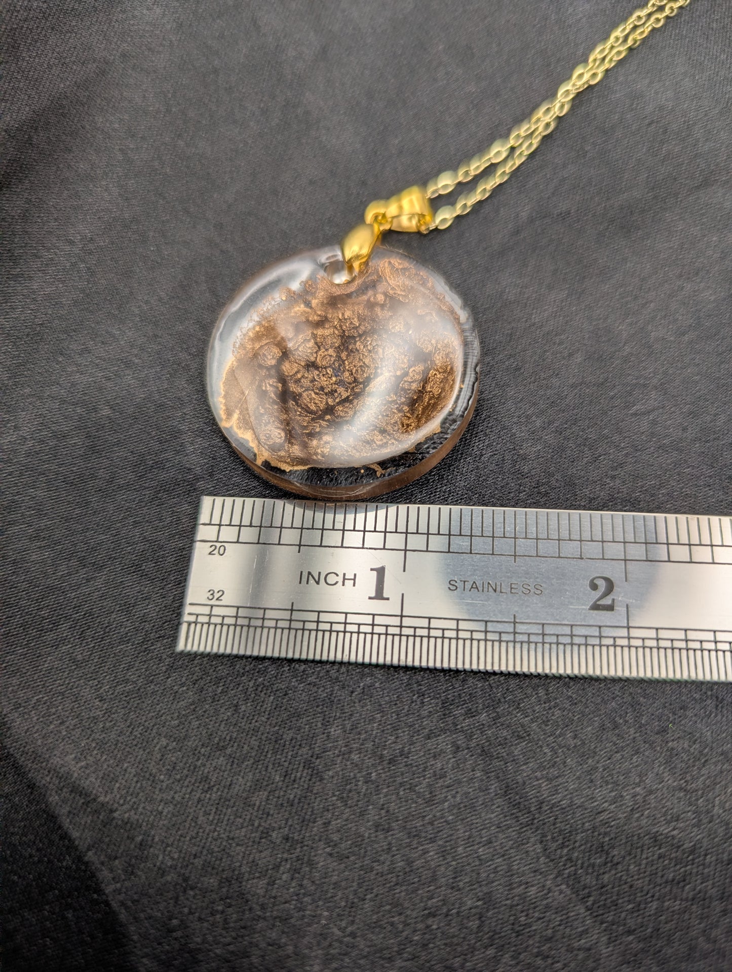 Size example pic of pendant size in inches, showing pendant is about 1.25 inches diameter.