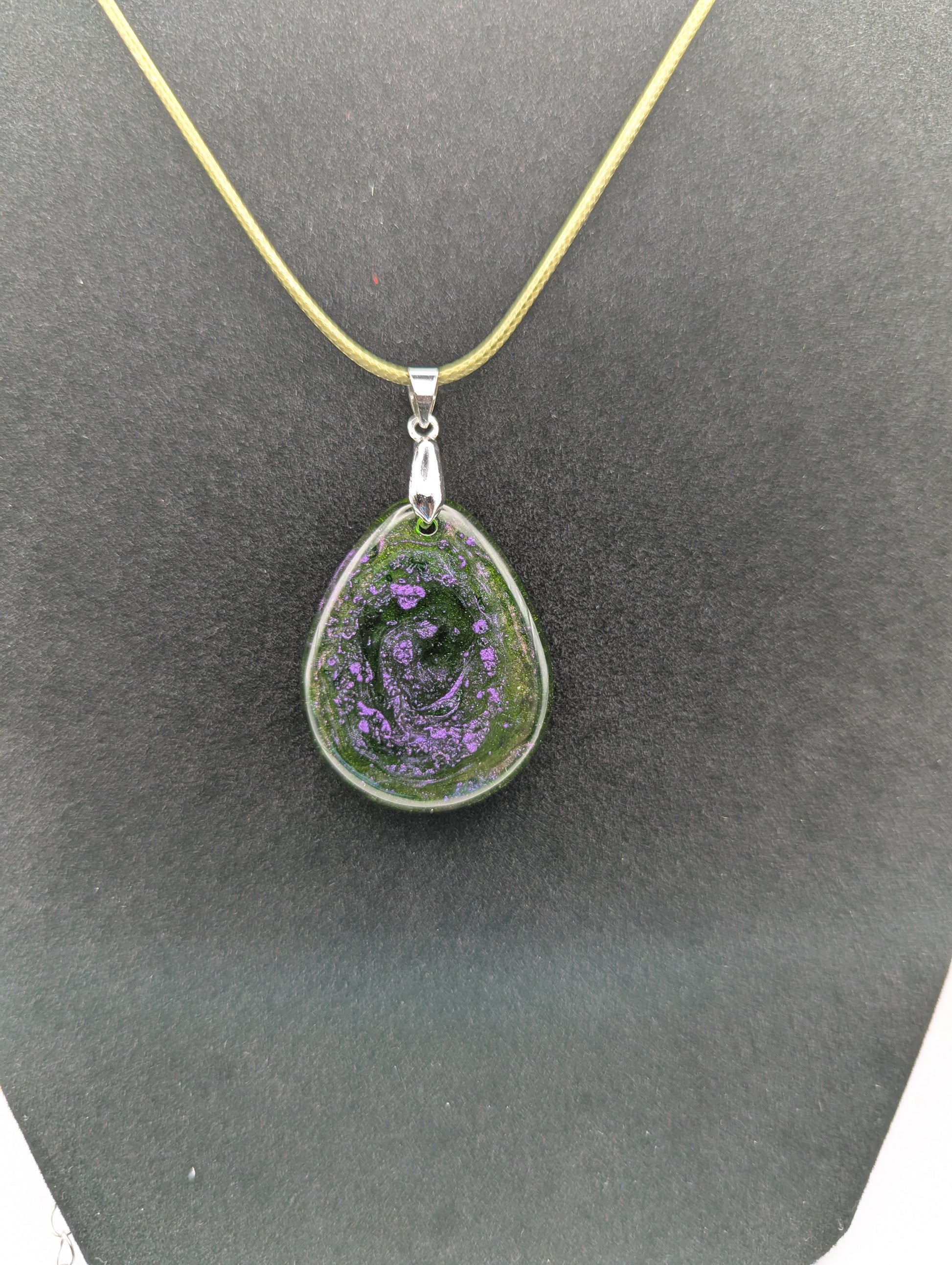 Teardrop Resin Pendant Necklace - Green & sparkly in color with pops of purple. Resin necklace on a waxed cotton cord.