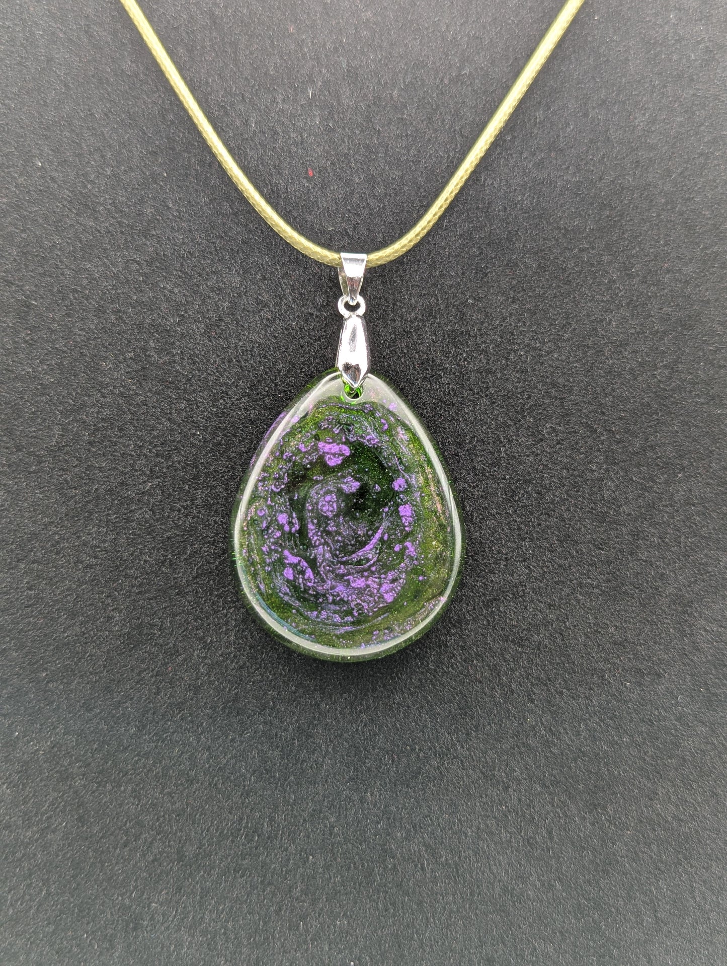 Teardrop Resin Pendant Necklace - Green & sparkly in color with pops of purple. Resin necklace on a waxed cotton cord.