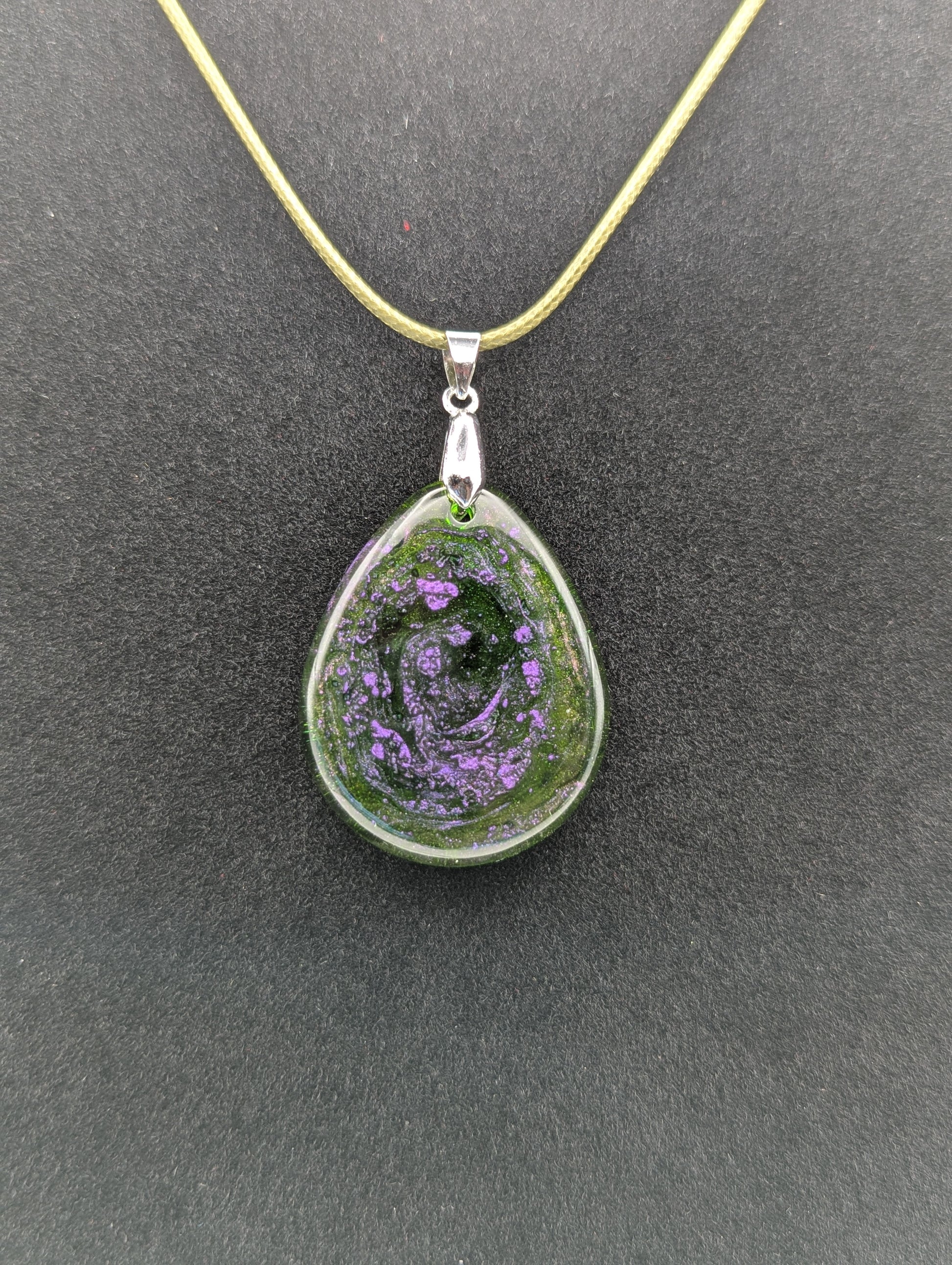 Teardrop Resin Pendant Necklace - Green & sparkly in color with pops of purple. Resin necklace on a waxed cotton cord.