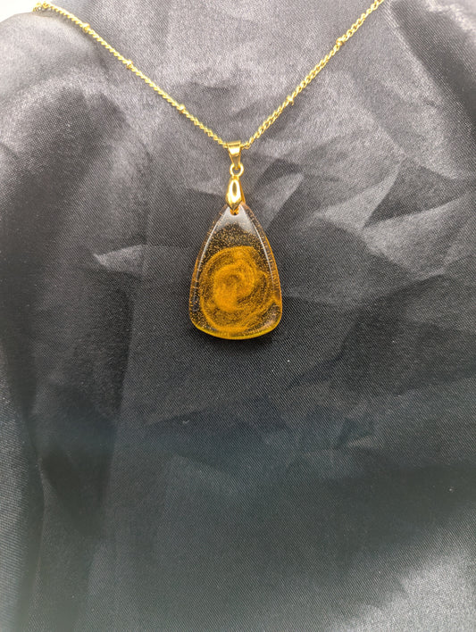 Yellow & Orange Swirl Rounded Triangle Resin Pendant Necklace on a gold pinch bail and a gold plated metal chain.