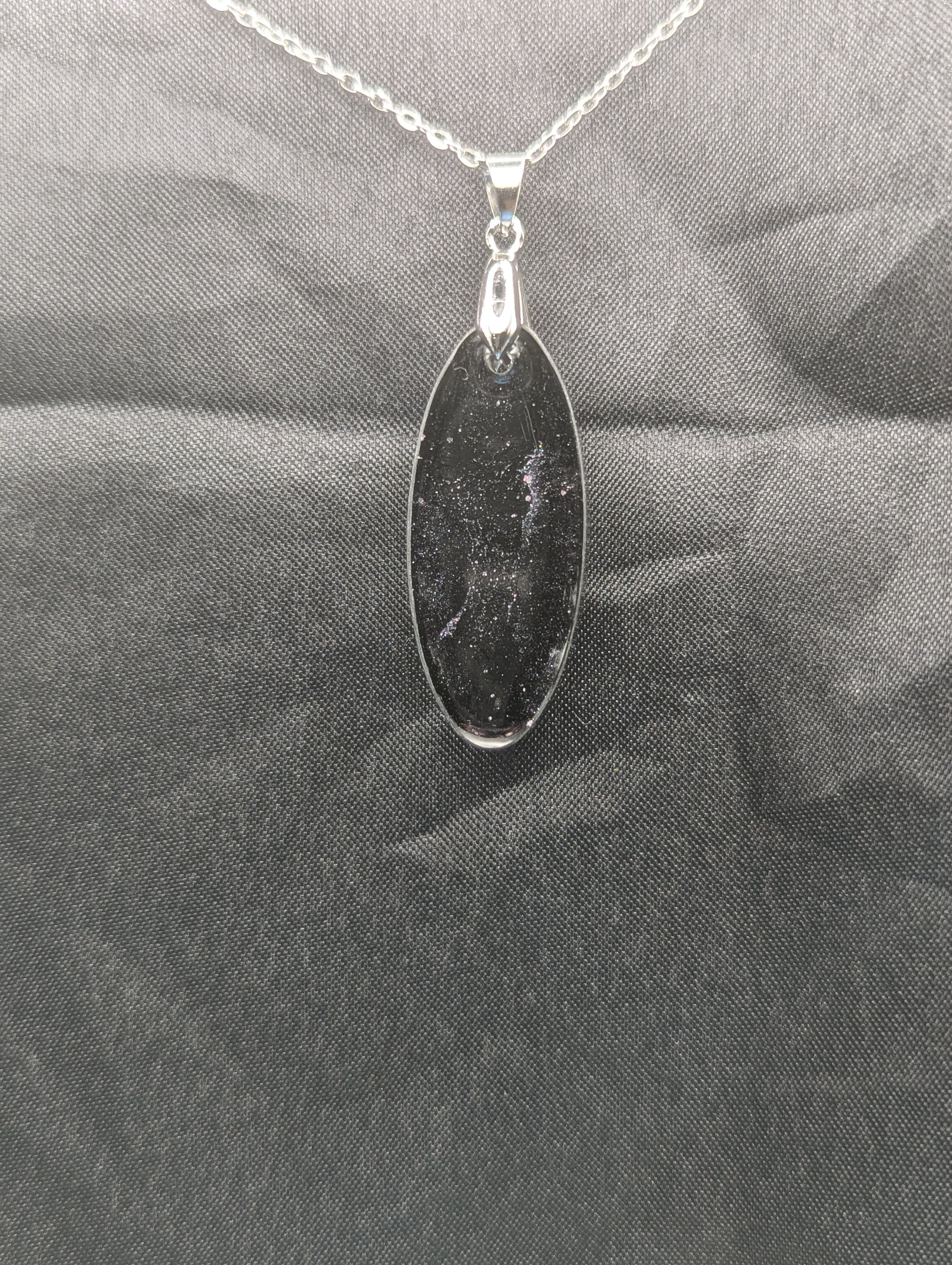 Back view of Black & Purple Swirl Ellipse Pendant on a silver pinch bail & stainless steel chain.