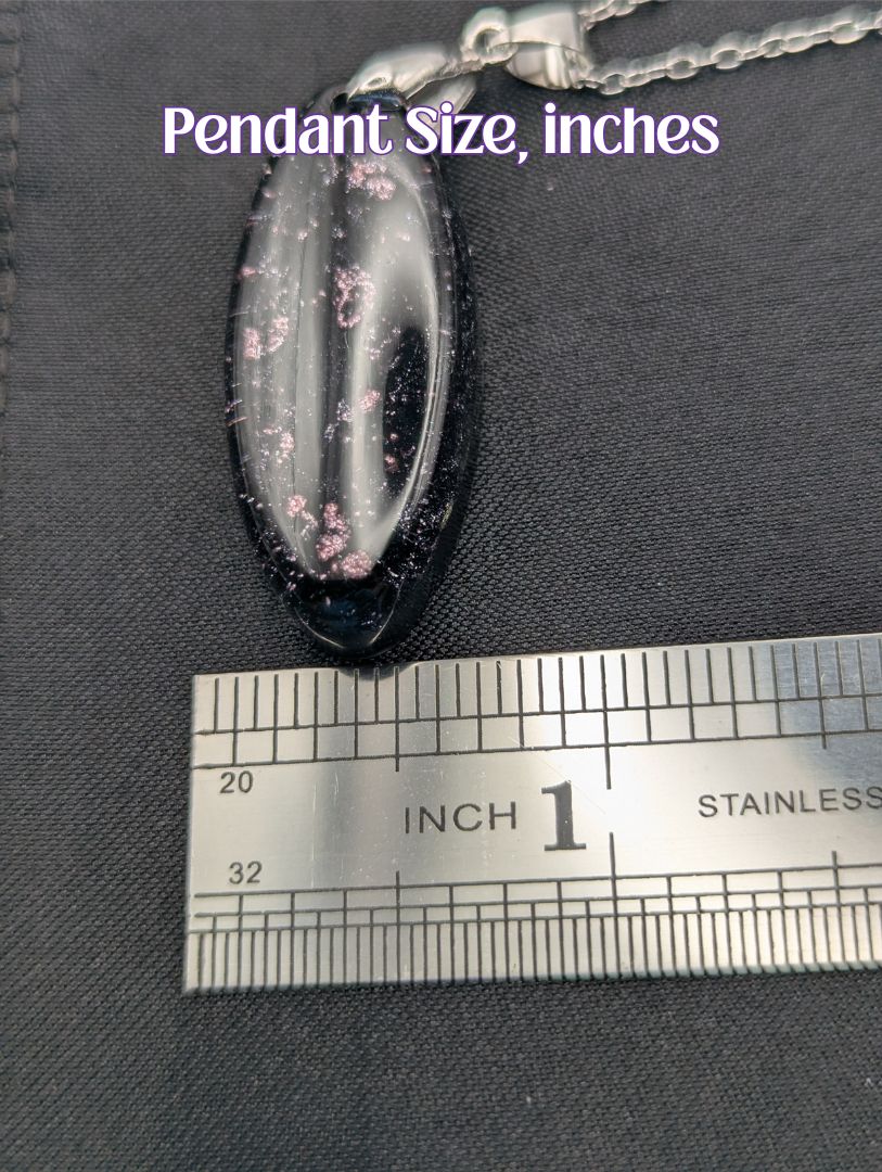 Size example pic of pendant size in inches, showing pendant is about 0.5 inches wide.