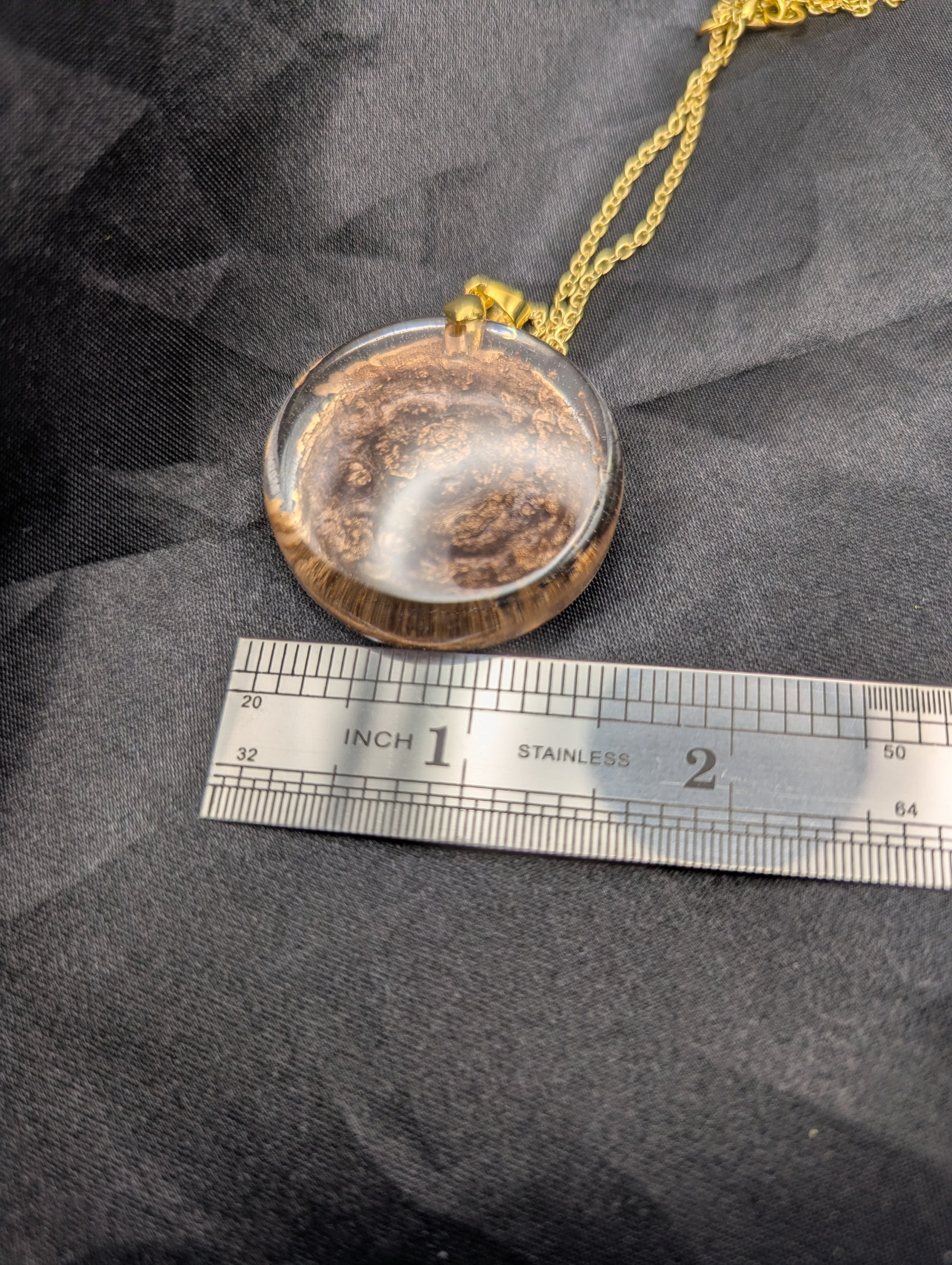 Size example pic of pendant size in inches, showing pendant is about 1.5 inches diameter.