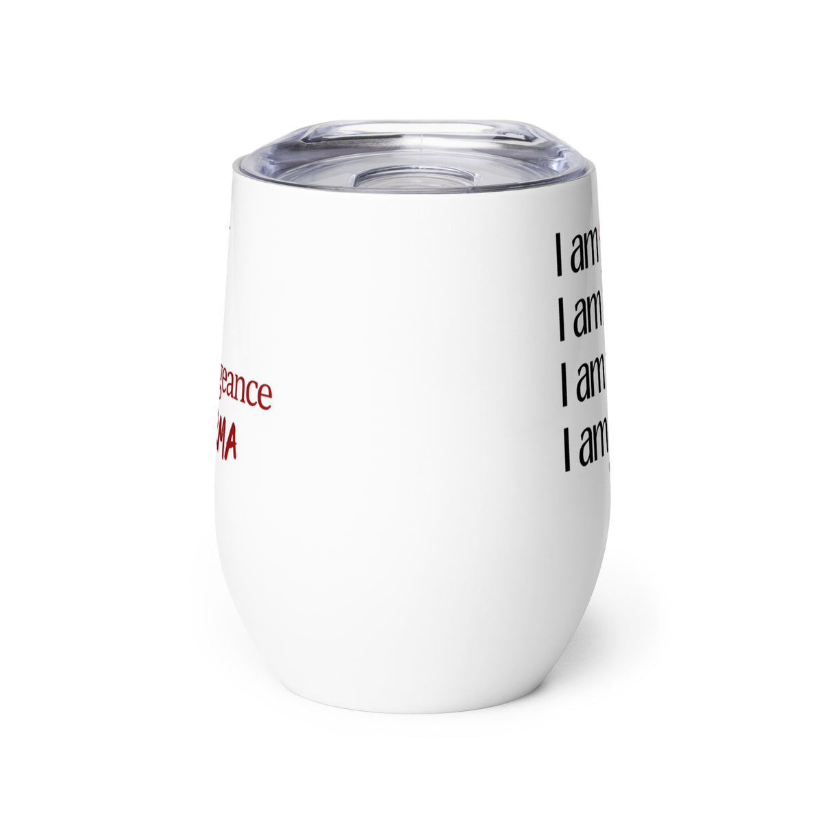 An insulated stemless wine glass with a lid for drinking wine in a tumbler. Cup is white in color with the words "I am spite, I am rage, I am vengeance, I am karma" on it. Each "I am" is in black font & the other words are in red font & different scripts.