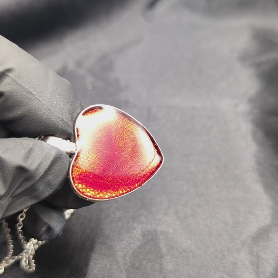 Sparkly red resin heart pendant necklace on a stainless steel chain