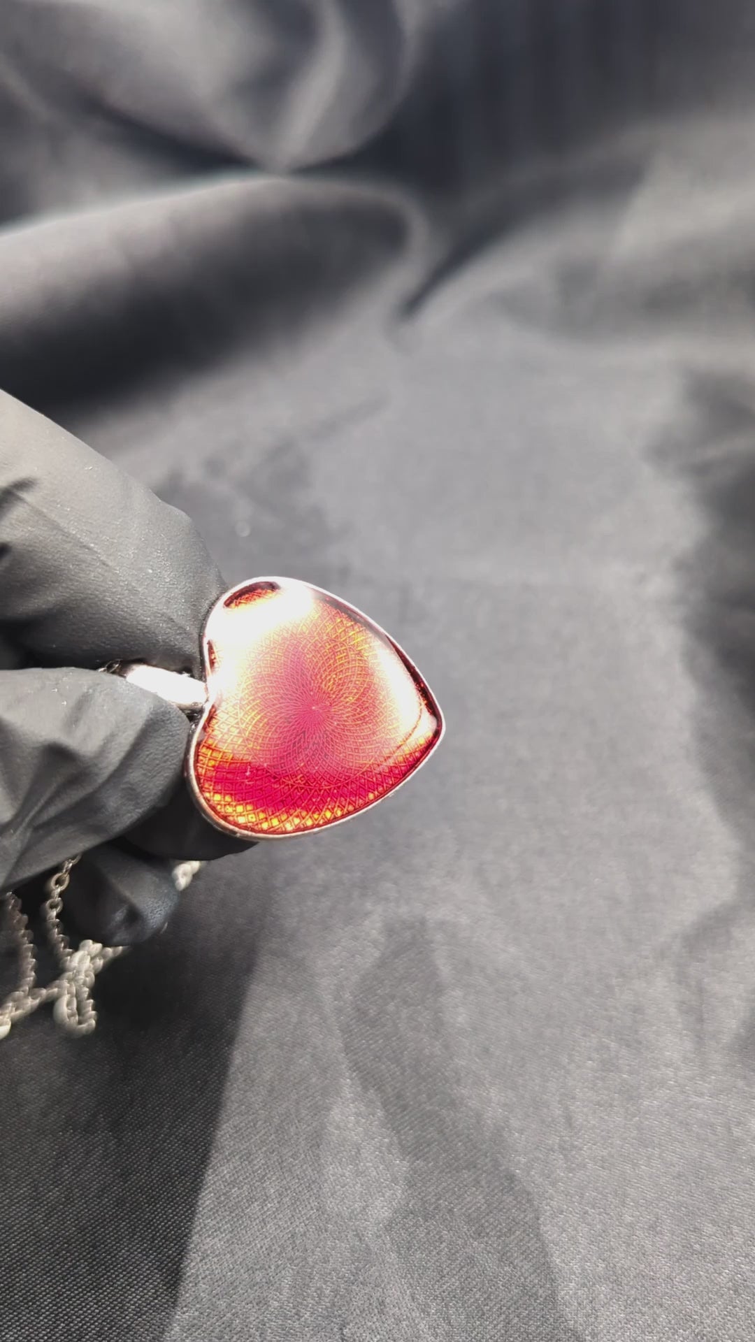 Sparkly red resin heart pendant necklace on a stainless steel chain